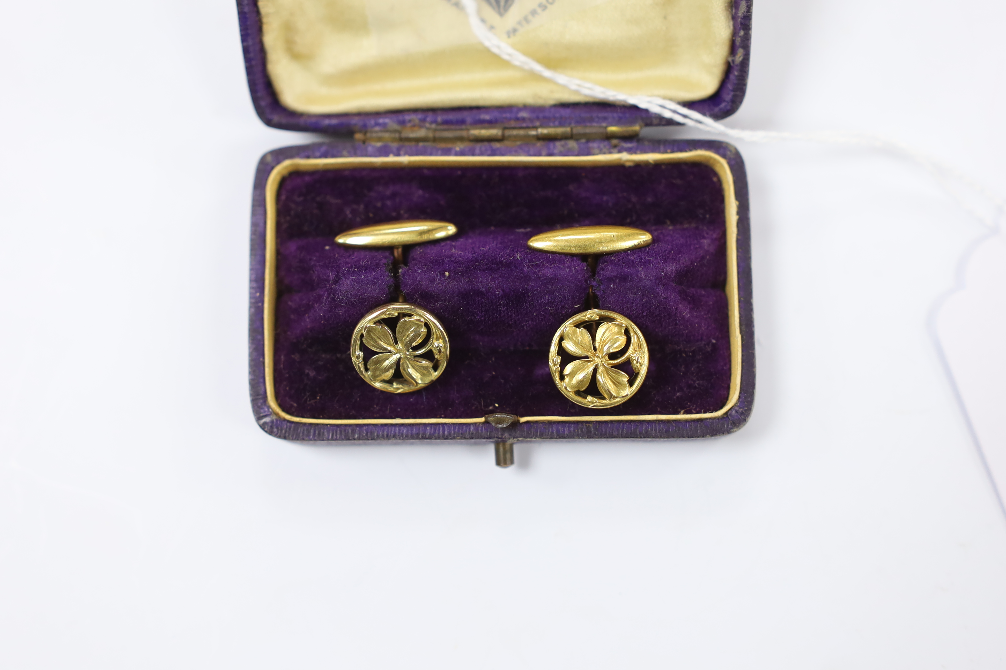 A pair of continental yellow metal overlaid circular cufflinks, of pierced foliate form, 14mm.
